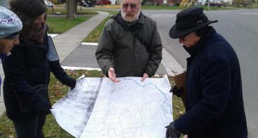 Peterborough. Residents pour over map during exploratory walk